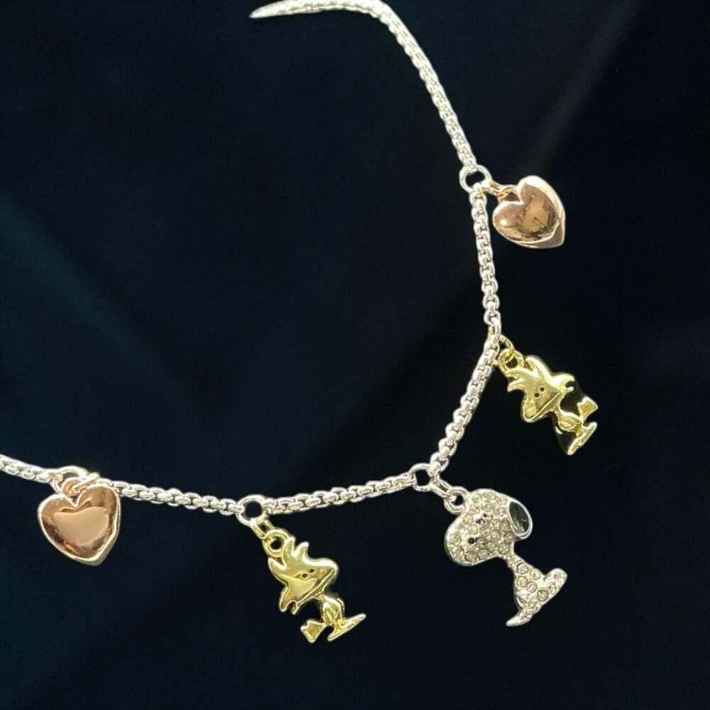 Peanuts Tri-Tone Crystal Snoopy, Woodstock, and Heart Charm Bolo Bracelet